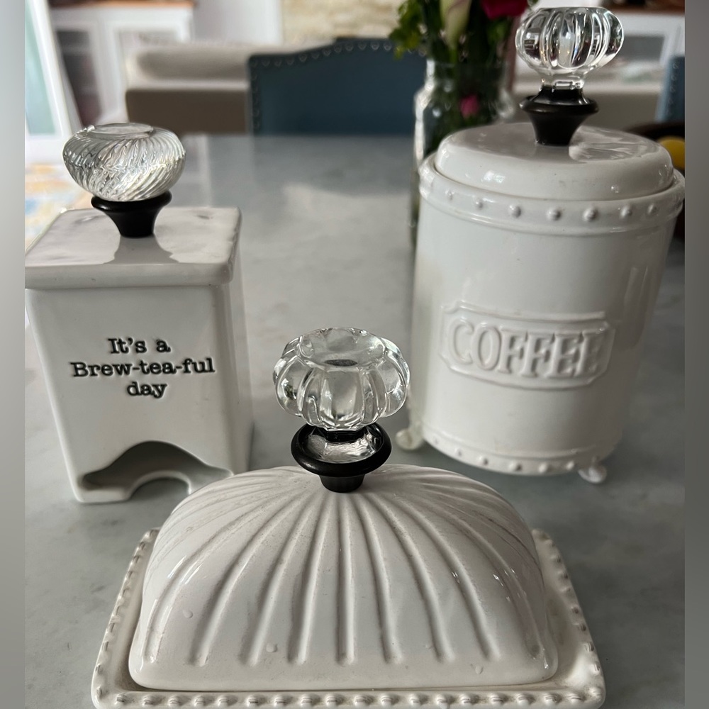 Mud pie kitchen accessories for coffee, tea, and butter.